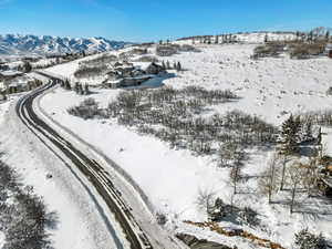 Snowy aerial view featuring a mountain view