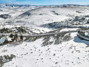 Snowy aerial view featuring a mountain view