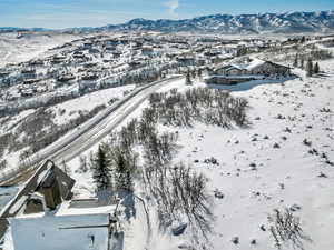 Snowy aerial view with a mountain view