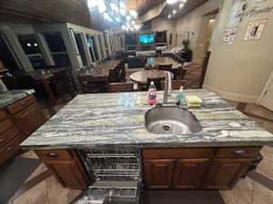 Interior space featuring sink and an inviting chandelier