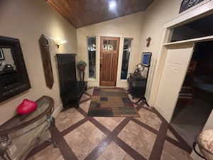 Foyer featuring wooden ceiling and lofted ceiling