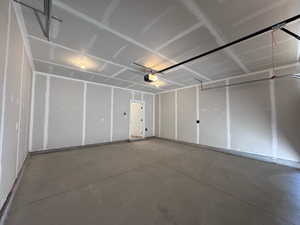 Garage featuring a garage door opener