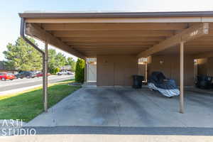 View of vehicle parking with a carport