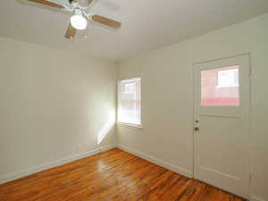 Entrance foyer with light wood-type flooring and ceiling fan