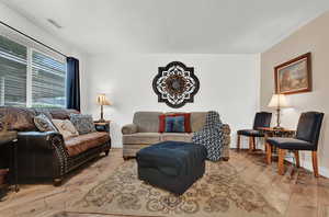 Living room with light wood-type flooring