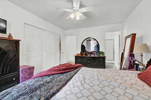 Bedroom with a closet and ceiling fan