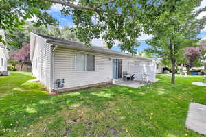 Rear view of house with a patio area