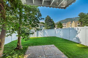 Beautiful back yard with a gate and mountain view