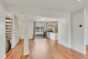 Light and bright kitchen, dining area, and living room with NEW (2024) vinyl flooring