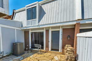 South facing front entrance with sliding glass door.