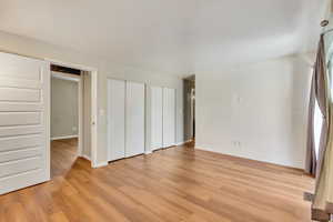 North facing bedroom with sliding glass door and outside balcony