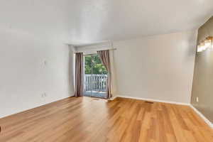 North facing bedroom with sliding glass door and outside balcony