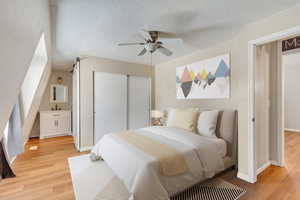 (Virtually Staged) South facing bedroom with updated vanity and connecting Jack and Jill Bathroom