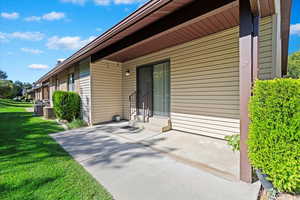 View of patio with central AC unit