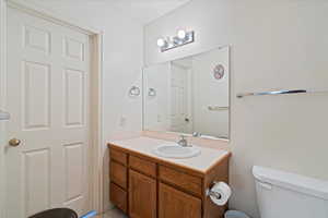 Bathroom with vanity and toilet