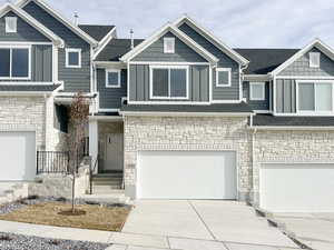 View of front of property featuring a garage