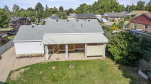 Back of house featuring a yard and a patio area