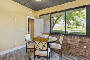 Dining room featuring hardwood / wood-style floors and a wealth of natural light