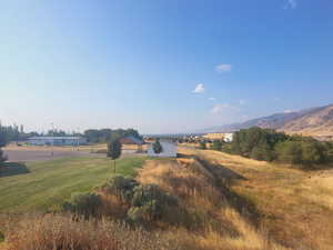 Property view of mountains with a rural view