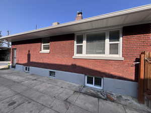 View of side of property with a patio area