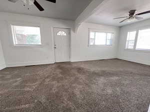 Entryway featuring carpet floors and ceiling fan