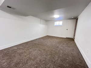 Basement with carpet flooring