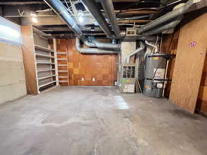 Basement with heating unit and secured water heater