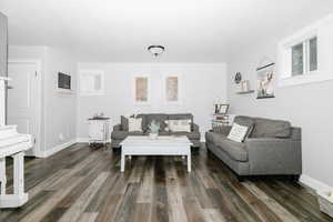 Living room featuring dark hardwood / wood-style floors