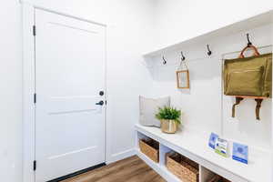 Mudroom with light hardwood / wood-style floors