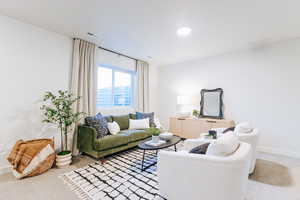 View of carpeted basement living room