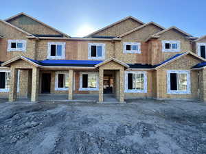 View of front of property with a patio area