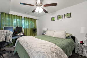 Bedroom with carpet and ceiling fan