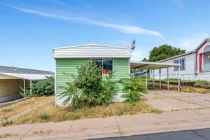 View of front of house with a carport