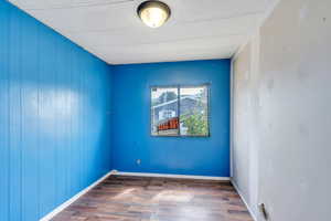 Empty room with wood-type flooring