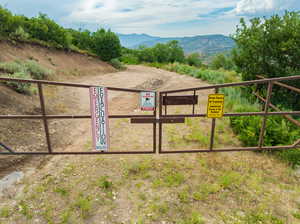 View of gate with a mountain view