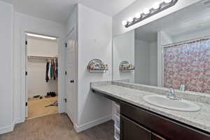 Bathroom featuring vanity and hardwood / wood-style flooring