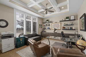 Fabulous office. Interior space featuring beamed ceiling, ceiling fan, a wealth of natural light, and coffered ceiling