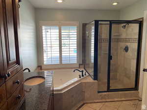 The separate tub and shower are enhanced by plenty of natural light.