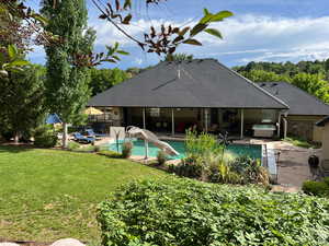 This home has it all.  This amazing yard has more than one focal point. Sure the pool is inviting but the grounds are breathtaking.