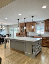 This kitchen has it all. The large island with tons of cabinets and special additions make cooking a treat with convenience, function and character.