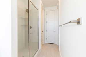 Bathroom with tile patterned floors and walk in shower