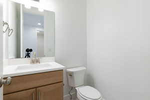 Bathroom with vanity and toilet