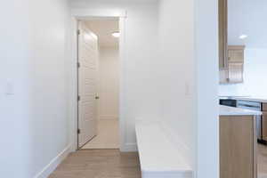 Mudroom with light hardwood / wood-style floors