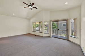 Main bedroom with balcony, large main bathroom, and walk in closet.