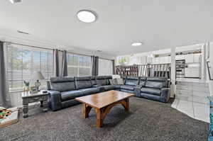 Tiled living room with crown molding