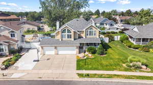 View of front facade with a garage and a front yard