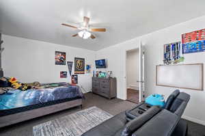 Bedroom featuring carpet and ceiling fan