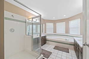 Bathroom with vanity, plus walk in shower, and tile patterned floors