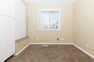 Unfurnished room featuring carpet floors