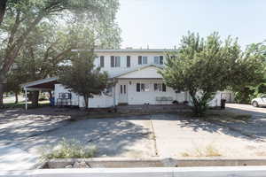 View of front of home with a carport